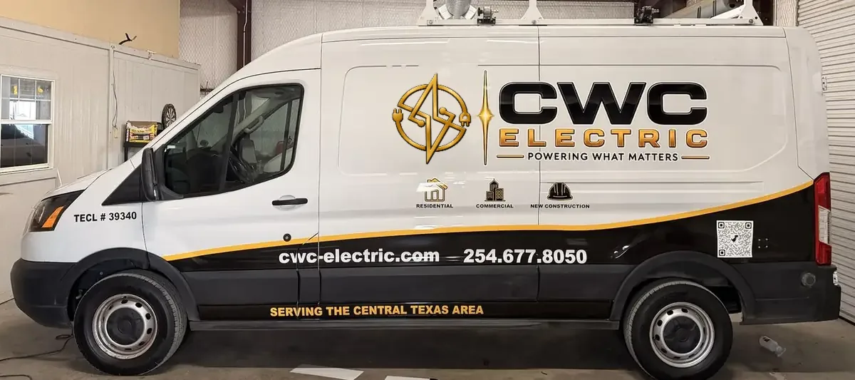 CWC Electric service van with the white, black, and gold company wrap